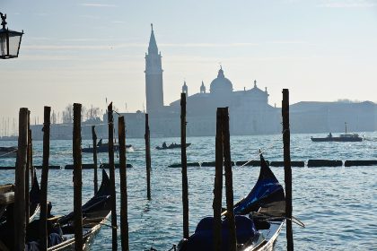 Gondolas And Mooring Poles Across The Lagoon — Matthew Satchell